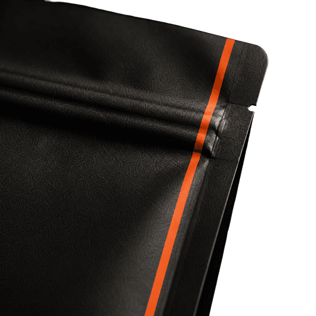 Close-up of a State Coffee bag's corner, the orange stripe against a black background.