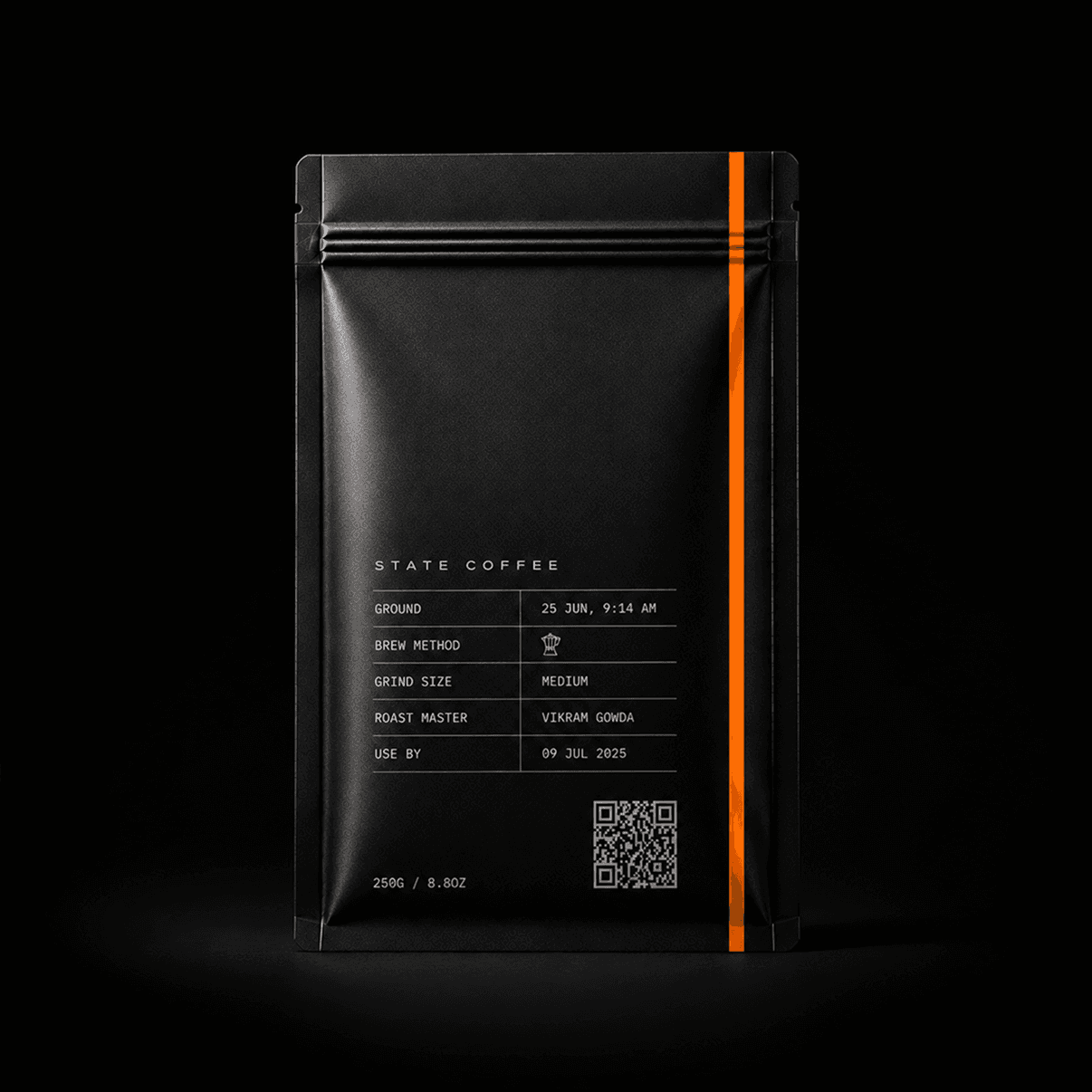 A black State Coffee bag with an orange stripe, lit against a dark background.